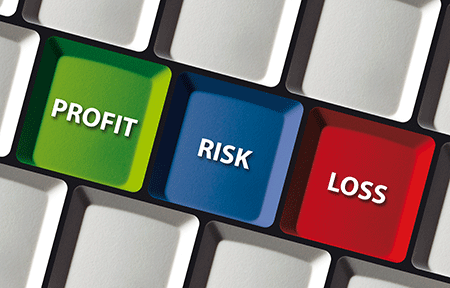 keyboard with the words profit, loss, risk