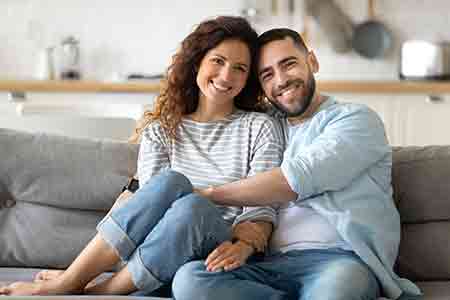 Happy couple embracing the investing journey