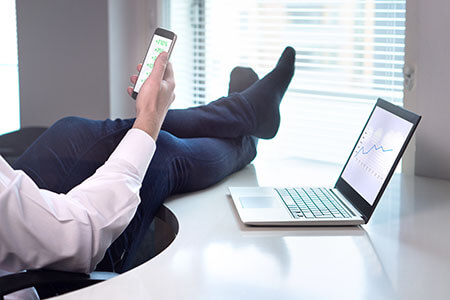 Full time trader sitting in chair