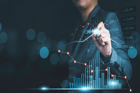 a man is analysing a rising stock chart as he maximises his capital and income