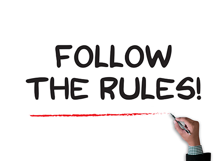 sign with the words follow the rules