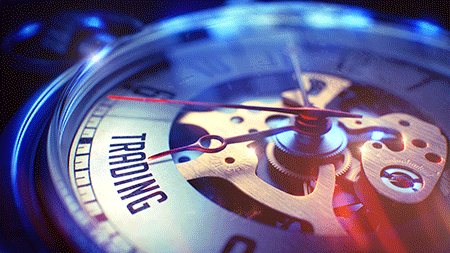 clock with the words trading on it