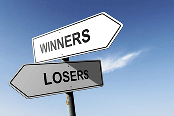 Signpost with the words winners and losers