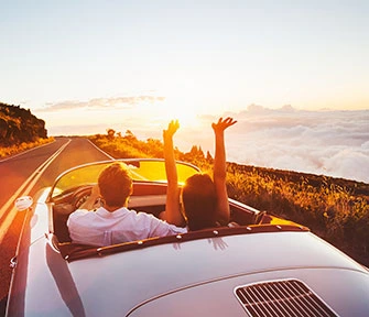 Couple driving down the road enjoying life
