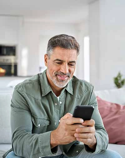 Gentleman checking his portfolio on his phone