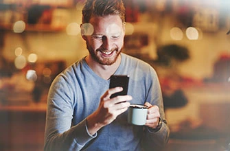 Man looking at trading results on his phone